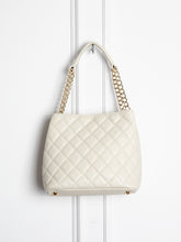 Small quilted leather bag with gold detail